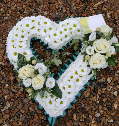 Open Based Heart - ****Please allow 3-4 days to create this design****

15 inch from £95.00

18 inch from £120.00

Larger sizes may be available upon request.

Available with either a Ribbon or Foliage edging.

Designs shown are examples only - actual flower content may vary depending on availability at time of ordering.
 
Larger sizes may be available please enquire for further details.

Basing available in white, dark pink, pale pink, yellow, lemon.

Basing in colours other than white may possibly incur additional cost please enquire for further details.